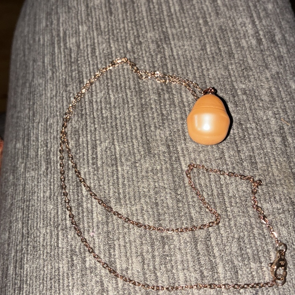 Peach color baroque shell pearl mounting is 925